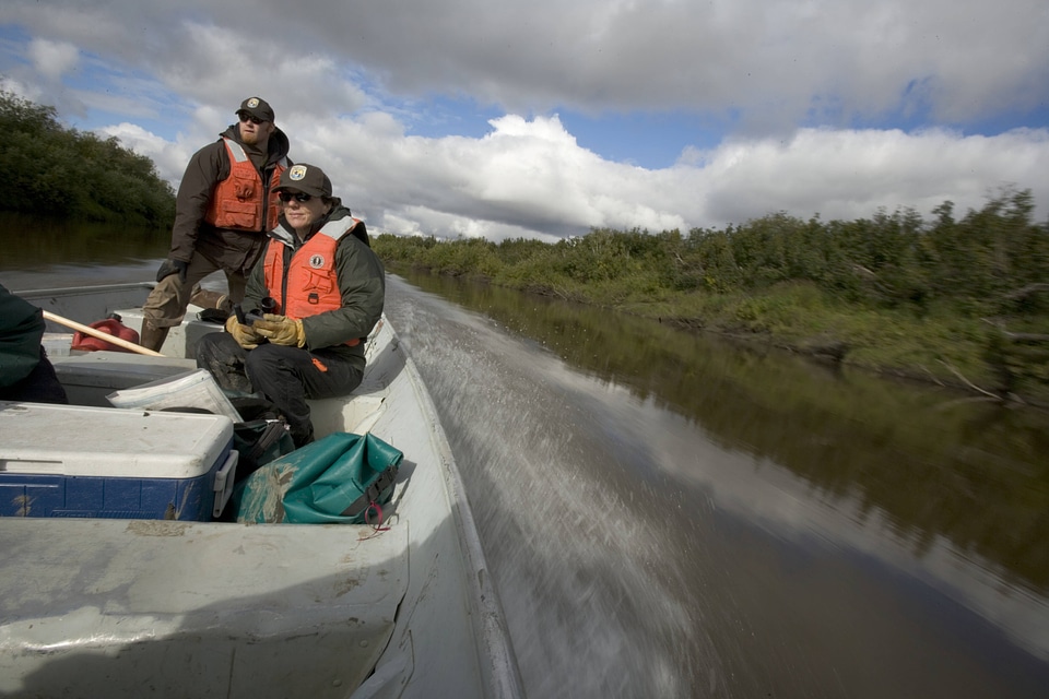 U.S. Fish and Wildlife Service employees on a boat