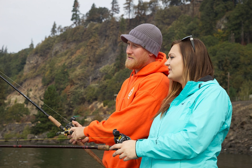 Young couple fishes for Fall Salmon