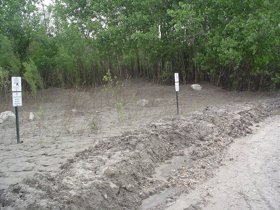 Vehicle access road flood damage