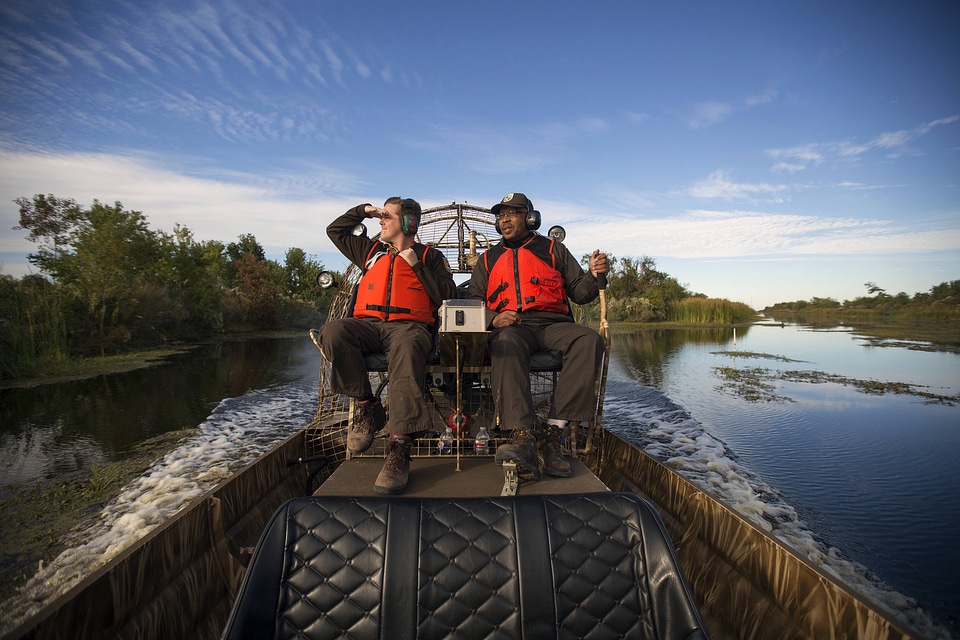 Employees maneauver an airboat at Bayou Sauvage NWR-1