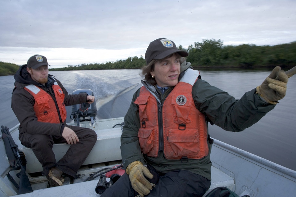 Service employees riding in a boat