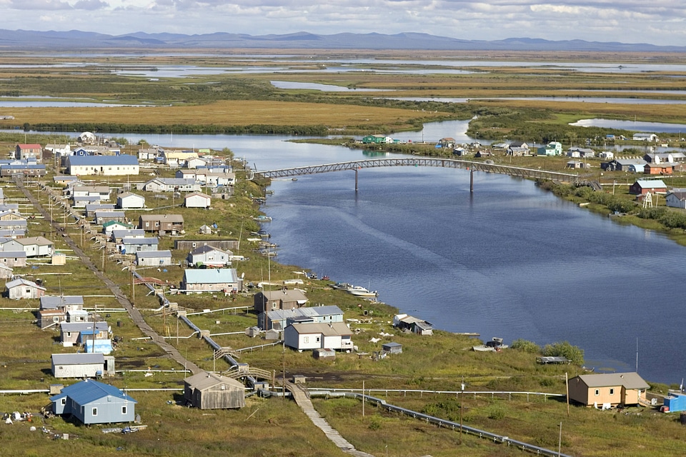Scenic view of village and bridge