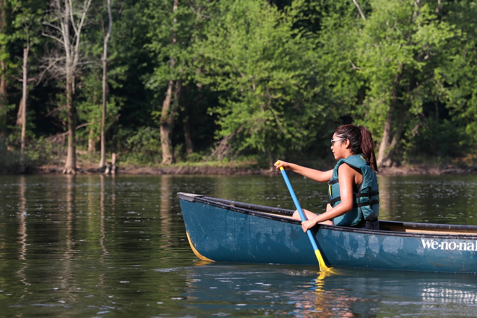 Tribal member canoeing at the Potomac River