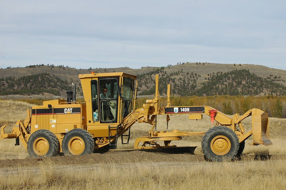 Service wage grade employee using dozer