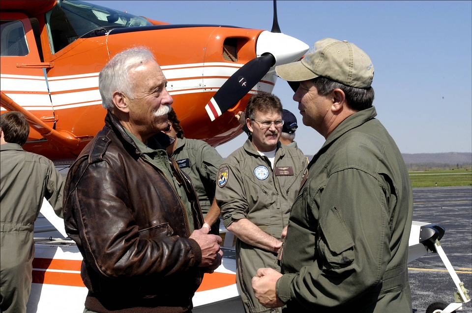 Service pilots outside airplane