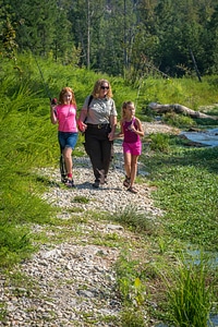 Uniformed FWS employee with two girls fishing-1