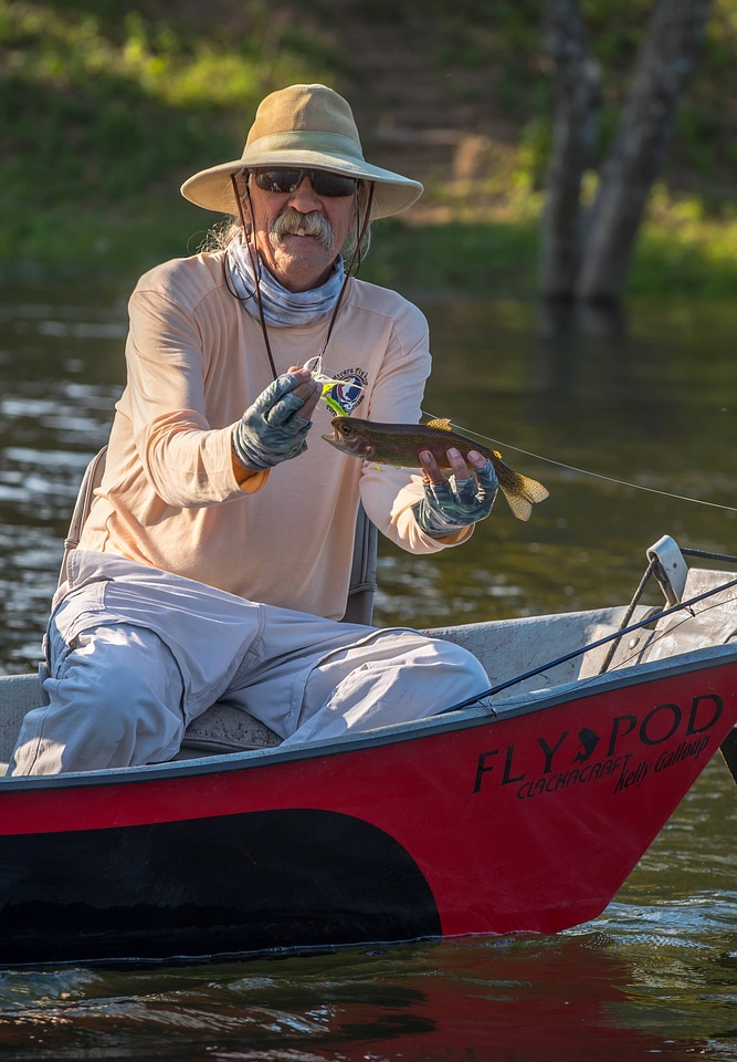 Angler with Rainbow trout on White River