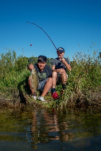 Two boys fishing for small mouth bass-1