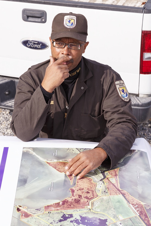 Employee with map of the refuge