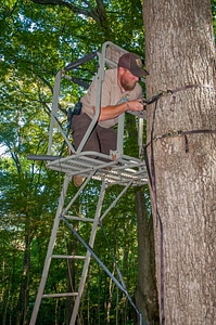 NCTC land management specialist inspecting deer stand for safety-1