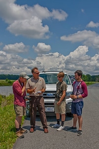 FWS staff talks to group of young birdwatchers at truck