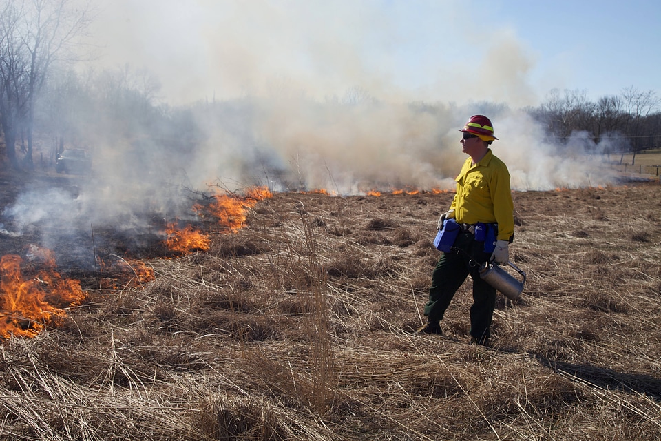 Firefighter watches burn