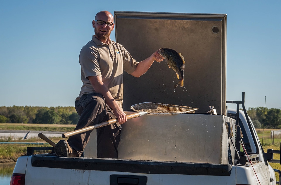 Biologist with smallmouth bass
