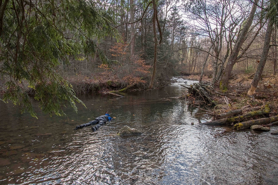Photographer taking pictures of brook trout in Seneca Creek