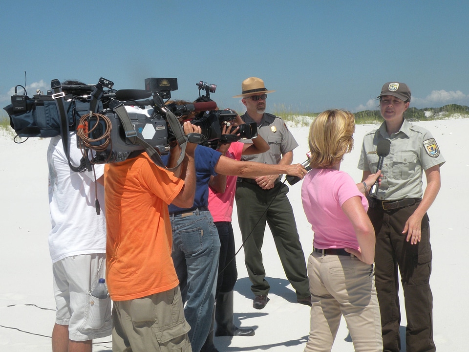 Wildlife Biologist Jackie Isaacs is interviewed by various news groups