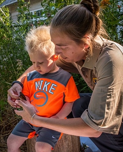 FWS employee shows child a monarch-2