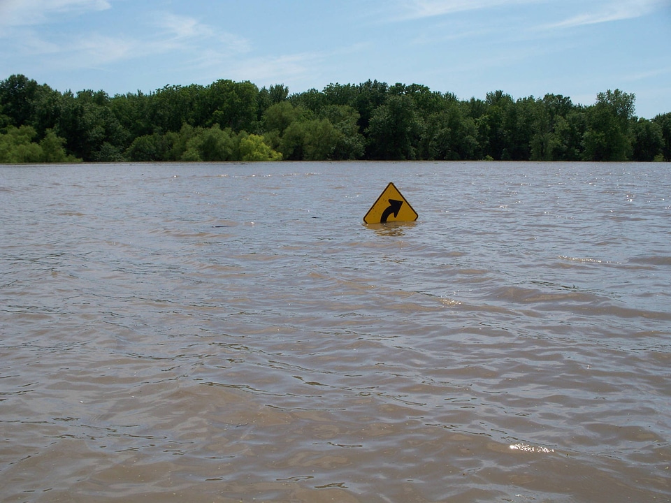 Sign at Swan Lake National Wildlife Refuge is covered in water
