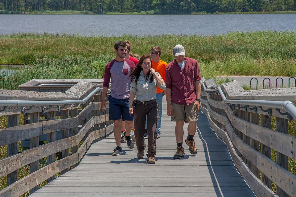 FWS staff leads group of high school students up boardwalk-2