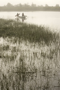 Paddling a canoe out of the fog