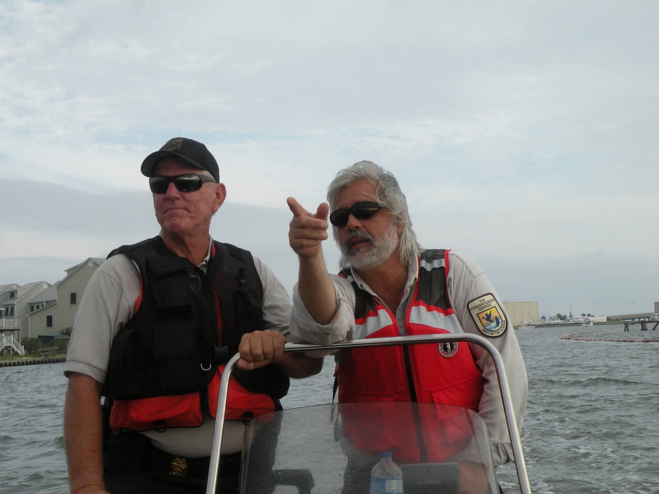 FWS employees inspect shoreline