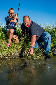 Girl with father with smallmouth bass-2