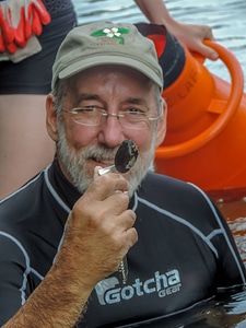 Instructor examines native mussel