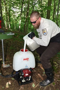 NCTC land management specialist uses motorized injector to treat ash trees-2