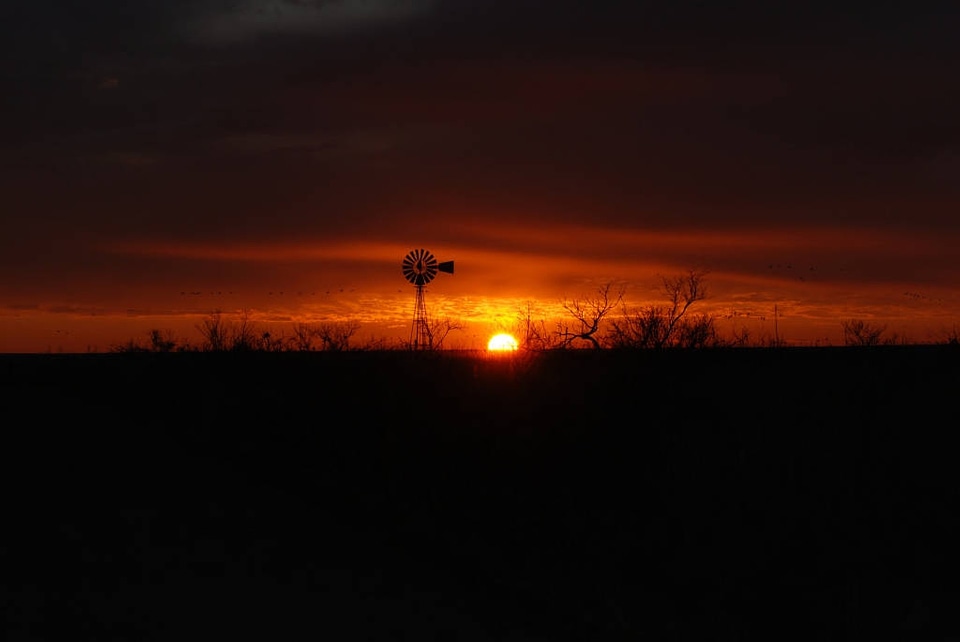 Windmill Silhouetted in the Sunset