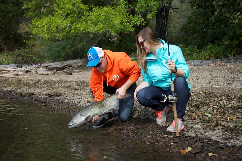 Young couple releases a Fall Salmon