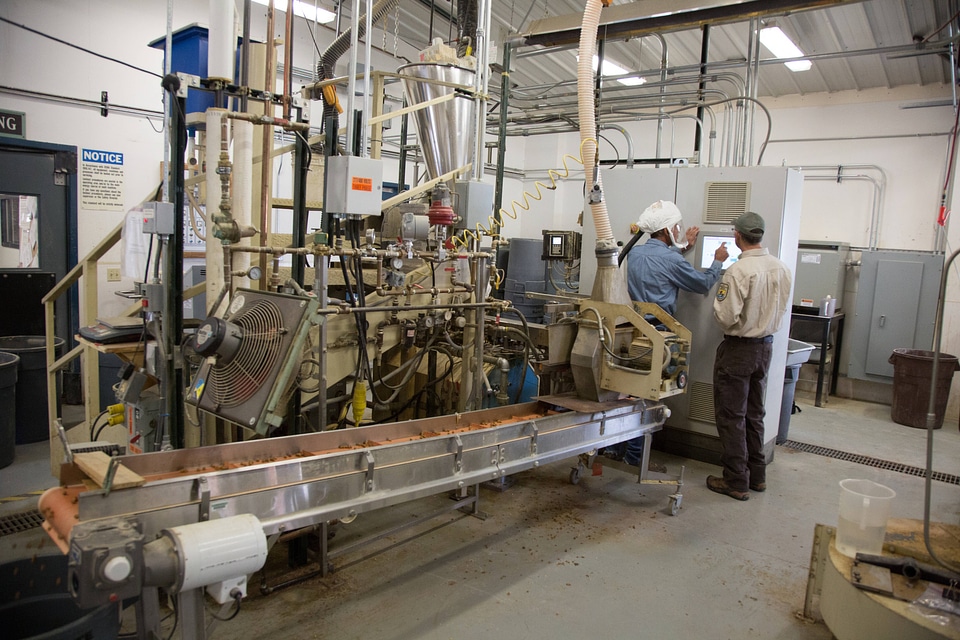Fish Nutritionist checks quality control of fish food-1