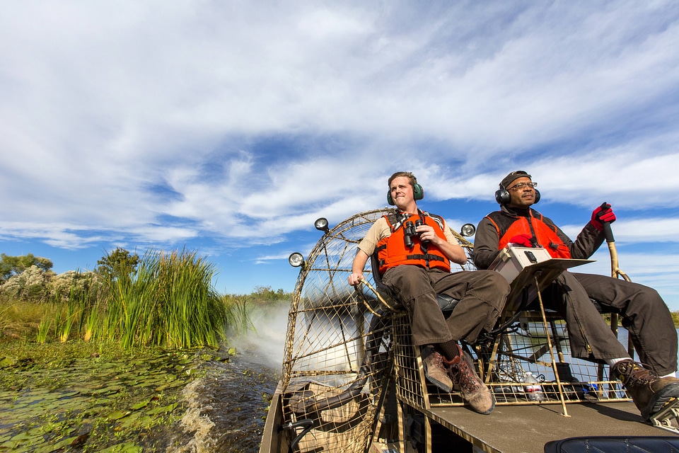 Employees maneauver an airboat at Bayou Sauvage NWR-1