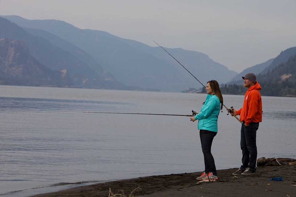 Young couple fishing for Fall Salmon-1