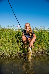 Girl catches smallmouth bass-1 photo