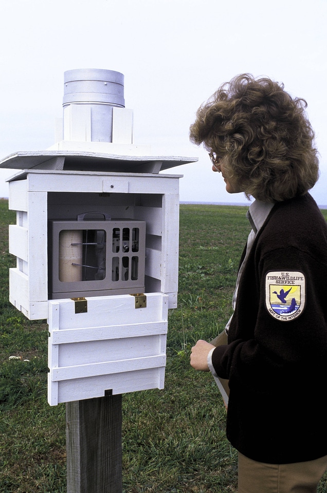 FWS  Employee Checking Weather Station