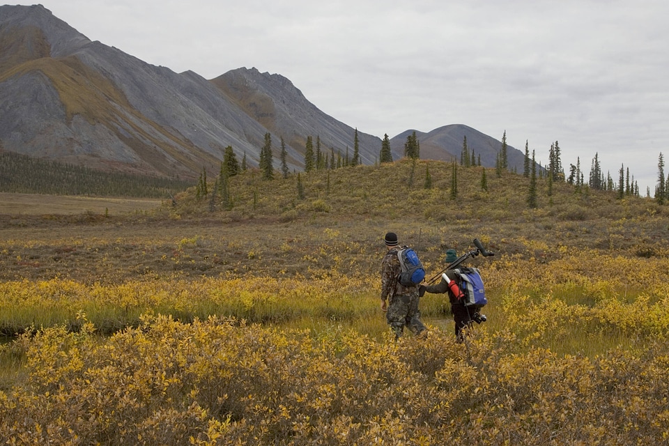 Hunters transporting their hunting gear