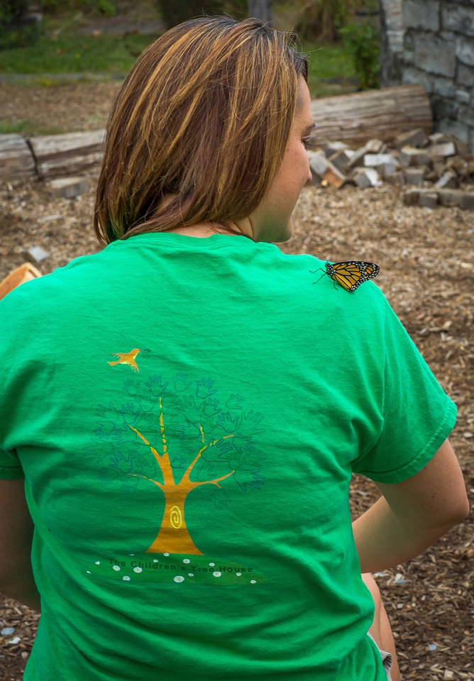 Woman with monarch butterfly on shoulder-2