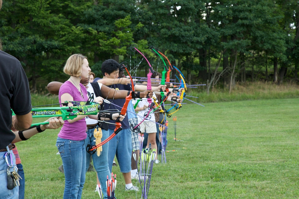 Students learning archery skills