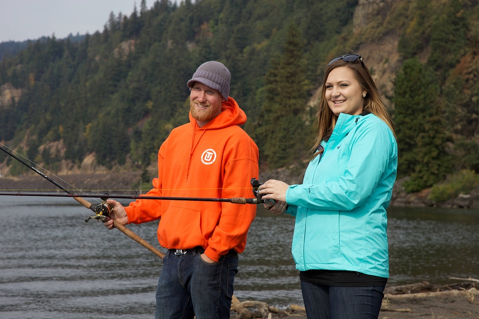 Young couple fishing for Fall Salmon-2