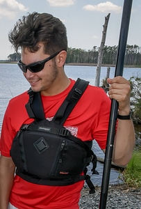 Kayaker with PFD and paddle photo