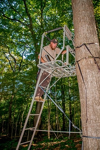 NCTC land management specialist inspecting deer stand for safety-4