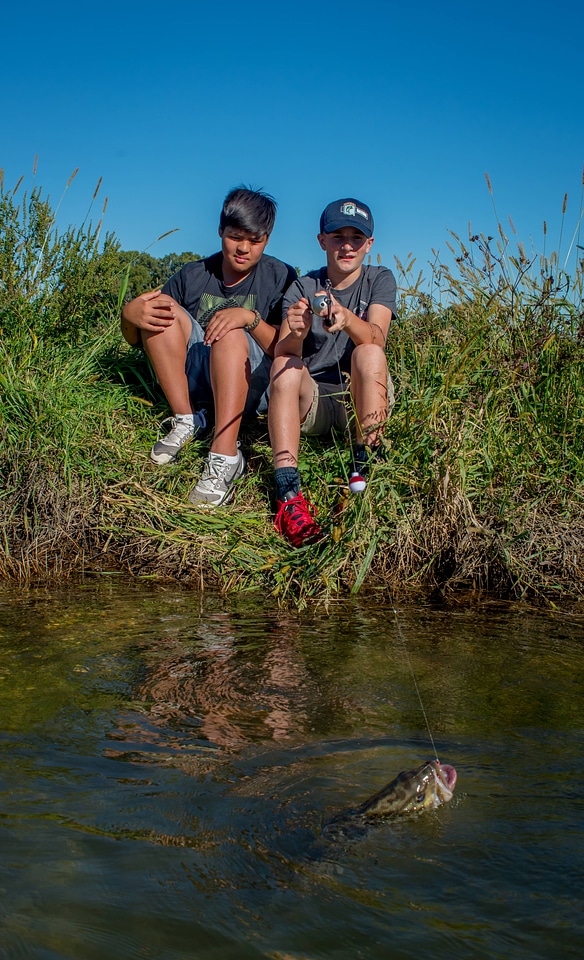 Two boys fishing for small mouth bass-2