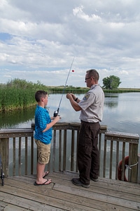 Ranger and young boy fishing-4