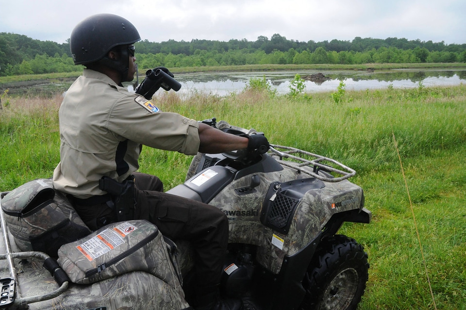 Refuge Law Enforcement Officer on ATV patrol