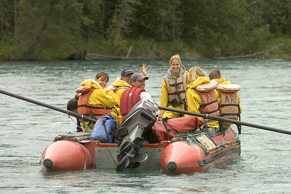 Group of people floating in a pontoon boat