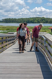 FWS staff leads group of high school students up boardwalk-3