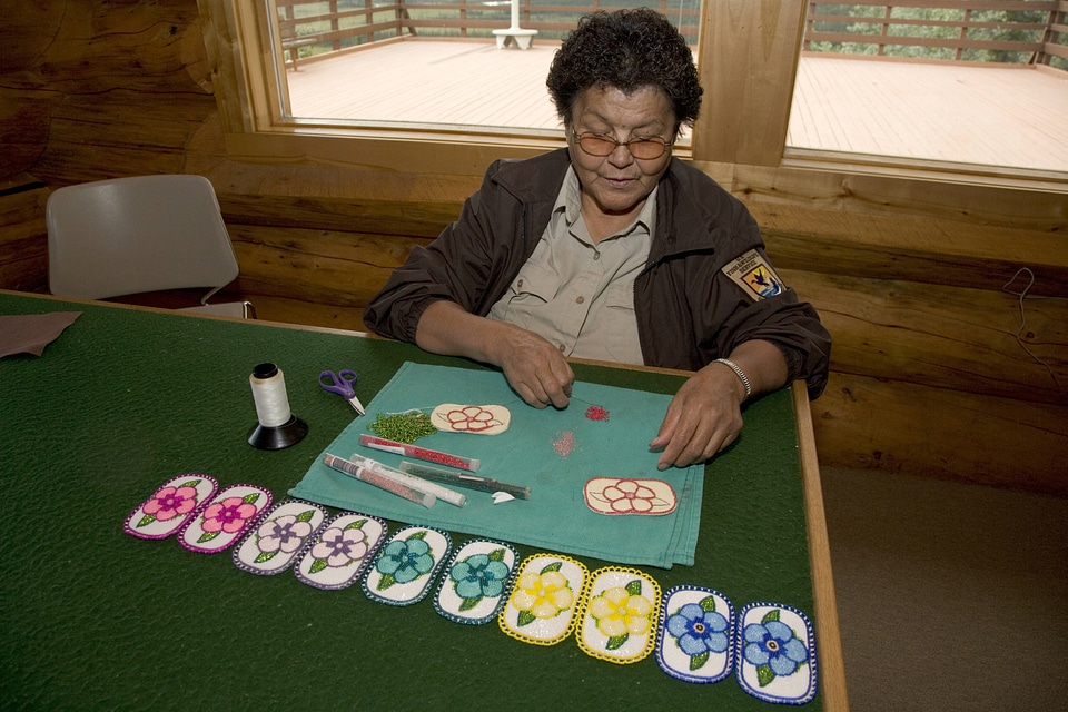 Native American Service employee working on crafts at Tetlin National Wildlife Refuge
