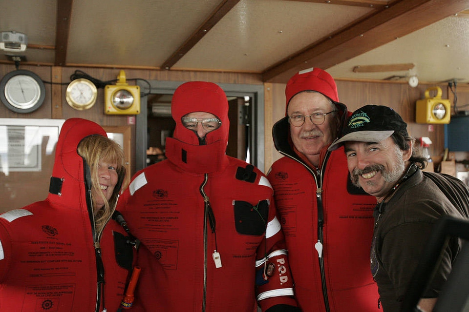 M/V Tiglax first mate Billy Pepper assists with Survival suits