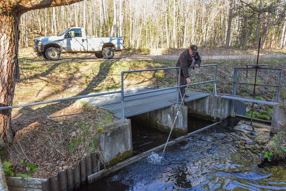 FWS at Pendills Creek National Fish Hatchery cleaning water intake