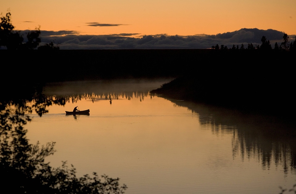 Canoeing under a beautiful orange sky
