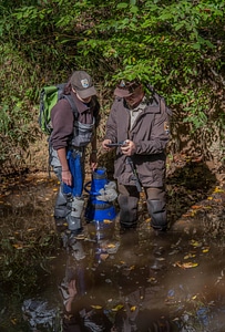 FWS mussel biologist, Morgan Wolf, confers with Tony Brady, mussel biologist